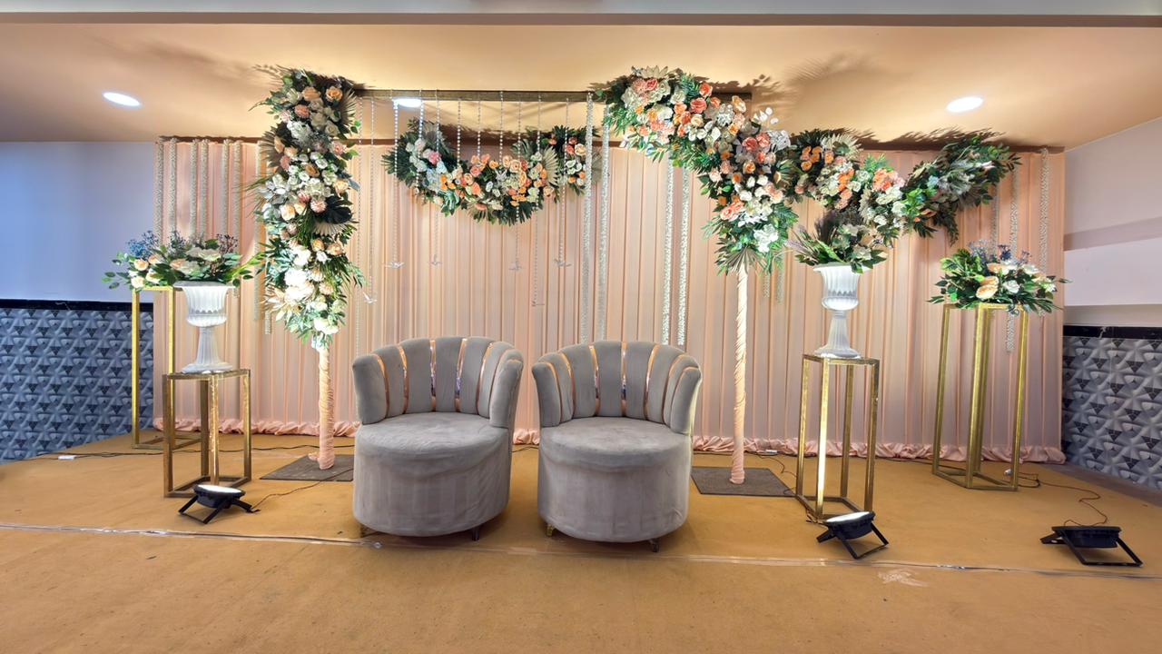 Floral wedding stage setup at Royal Celebration