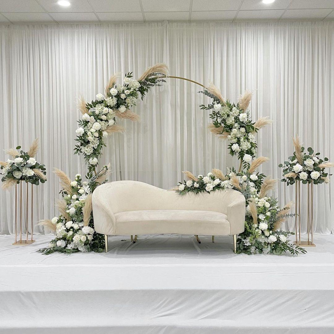 Soft white sofa stage with floral frame decor