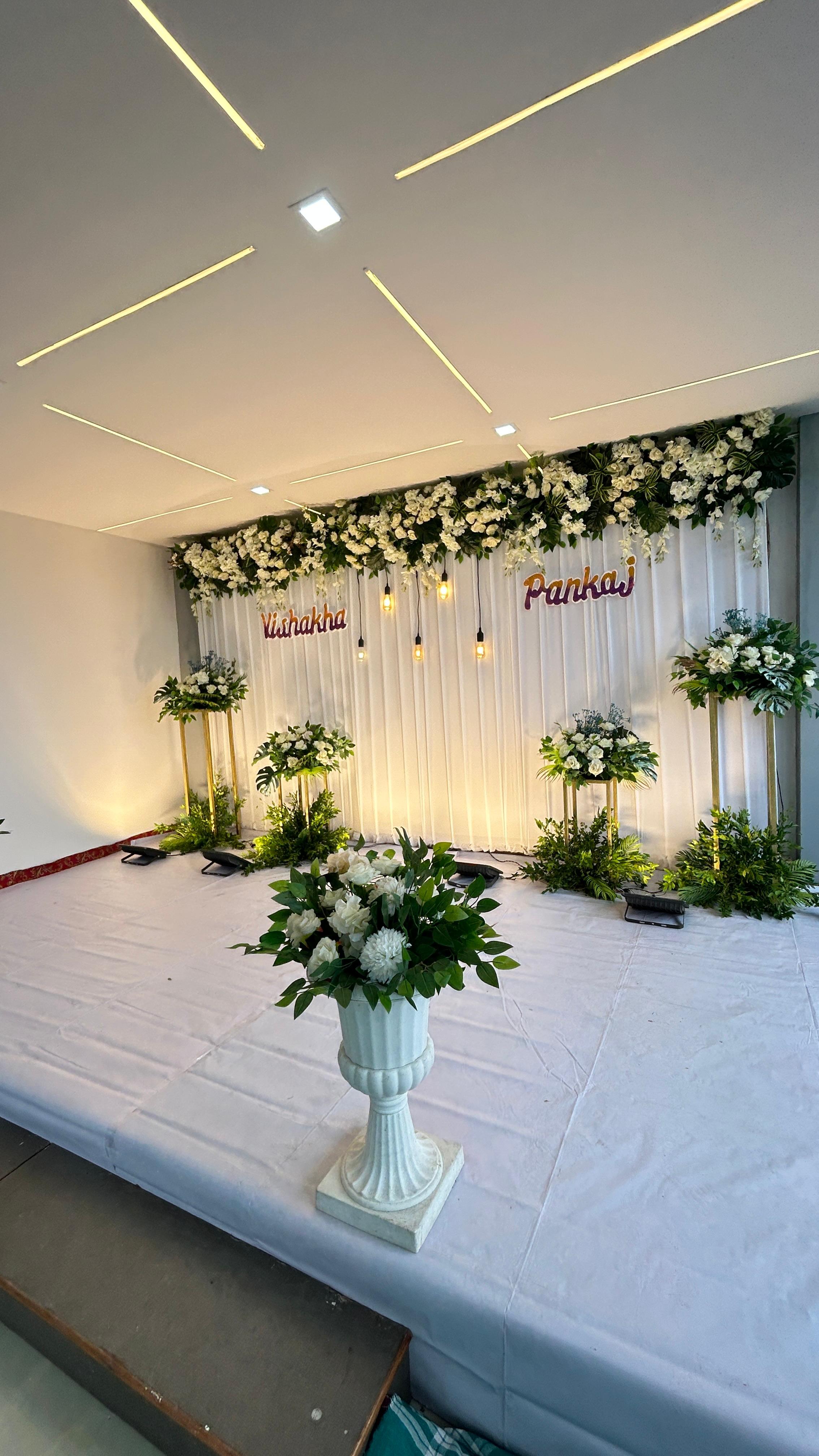 White floral stage with couple name styling