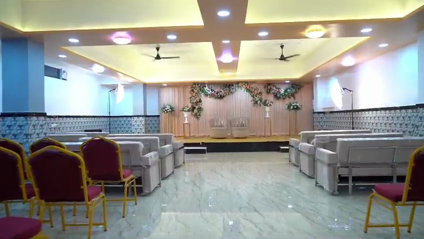 Decorated stage and lounge arrangement from a live wedding celebration